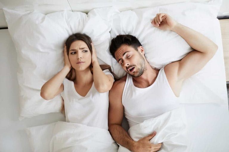 Service Featured Image - snoring male while annoying female partner